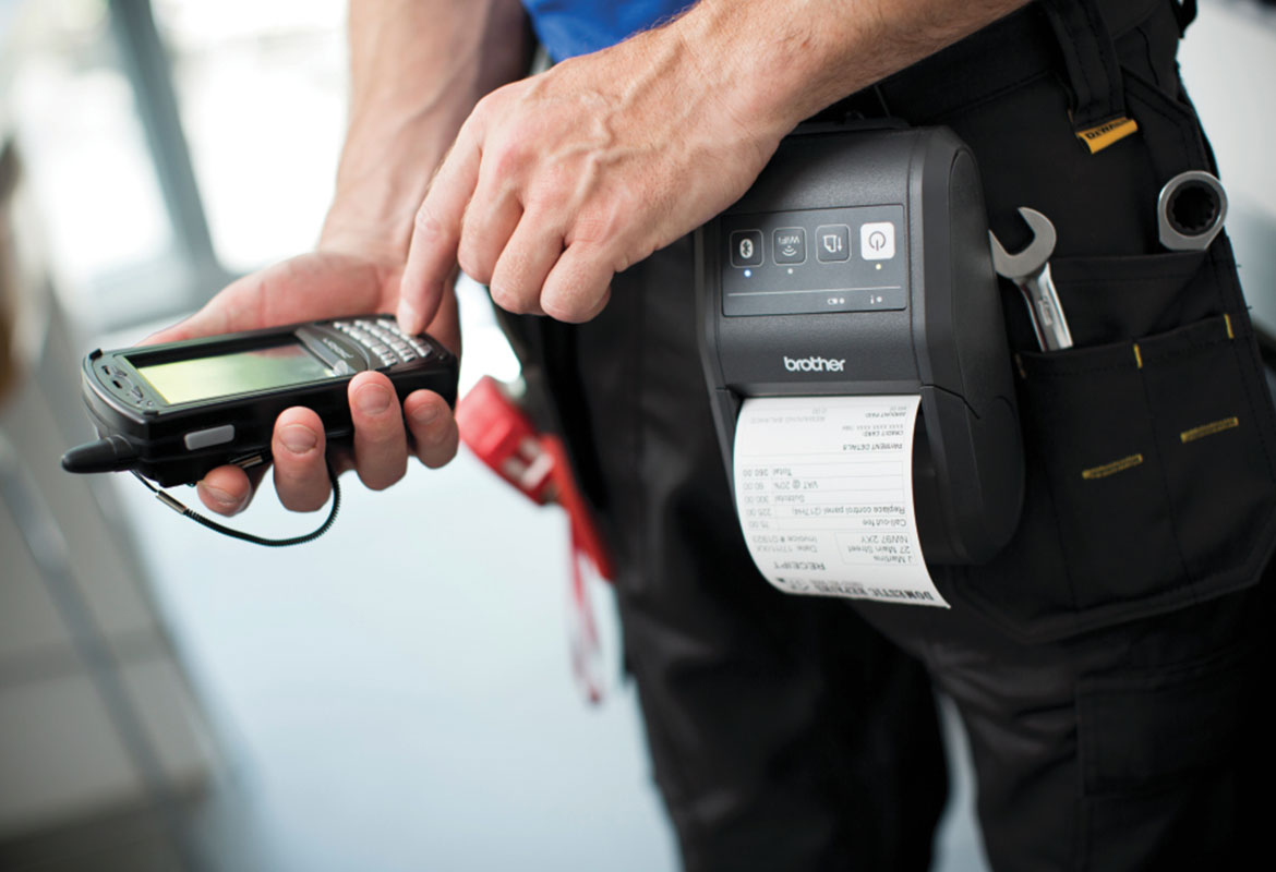 A field service worker printing to a mobile printer from a smartphone