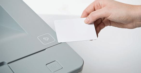 Swiping an ID card to login to a printer