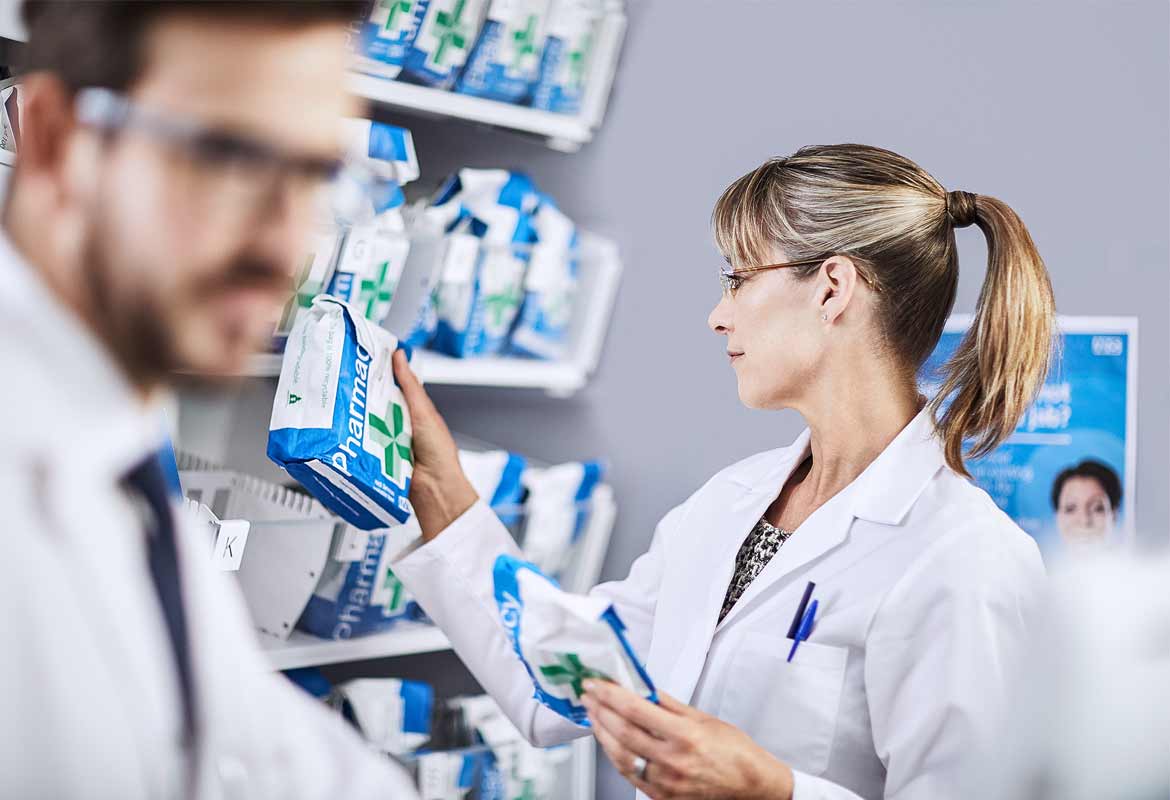 Pharmacist with a customer order