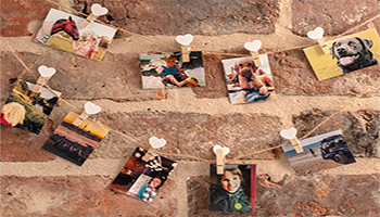 photos on an exposed brick background