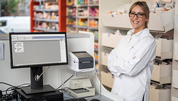 Pharmacy employee with the Brother TD label printer