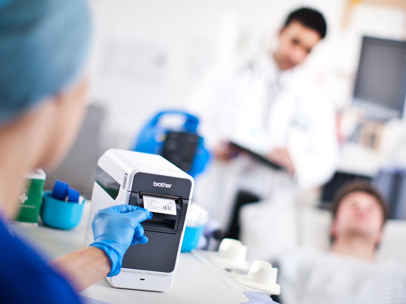 Brother TD2 series label printer in healthcare environment printing a label