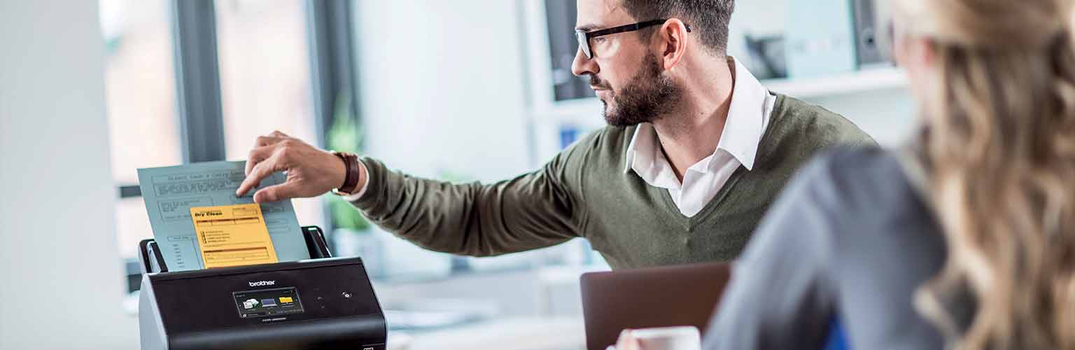man increases work productivity with Brother scanning solution