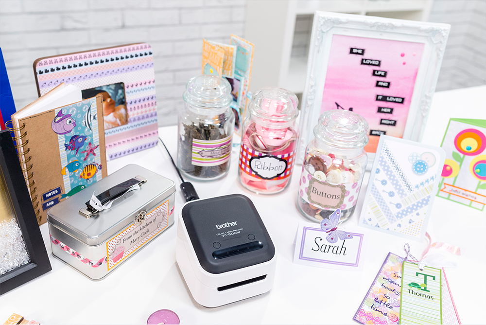 A mobile label printer on a table with items that have printed labels
