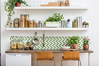 Modern kitchen with plants and labelled storage 
