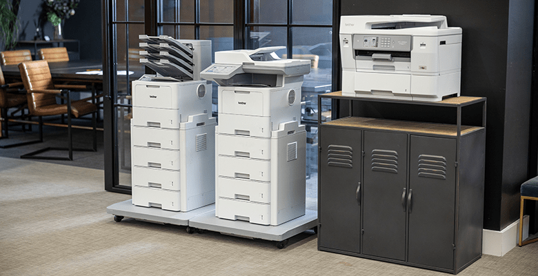 Three printers side-by-side in an office environment