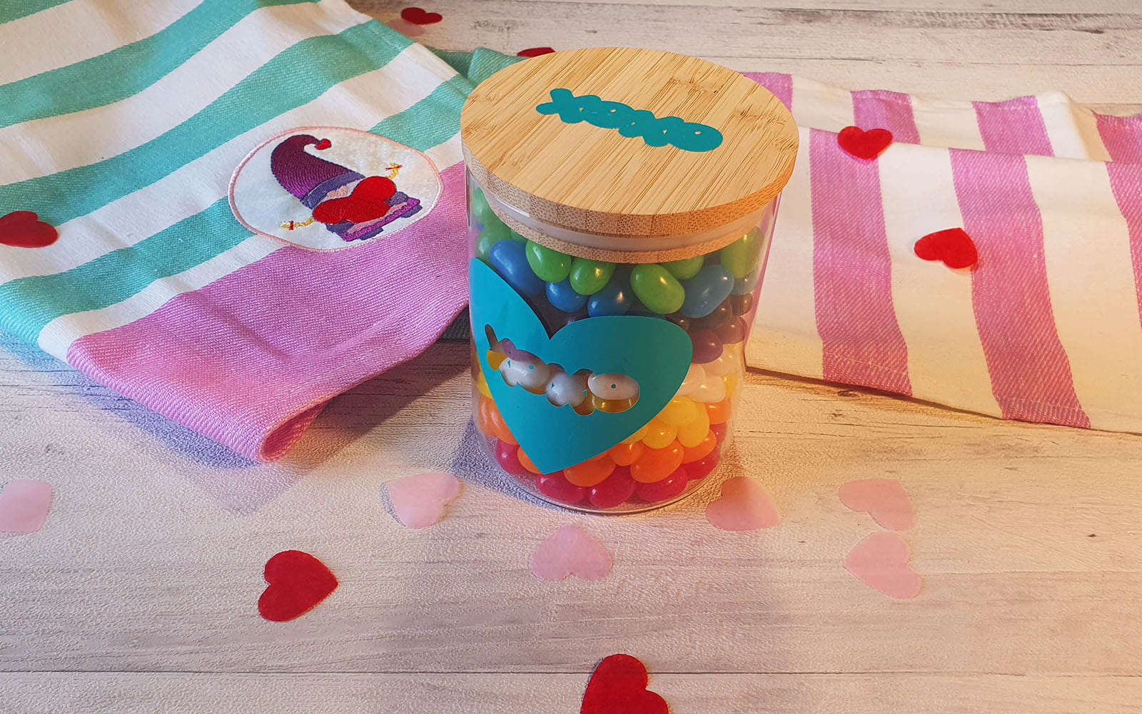 Treat jar with embroidered towel in the background