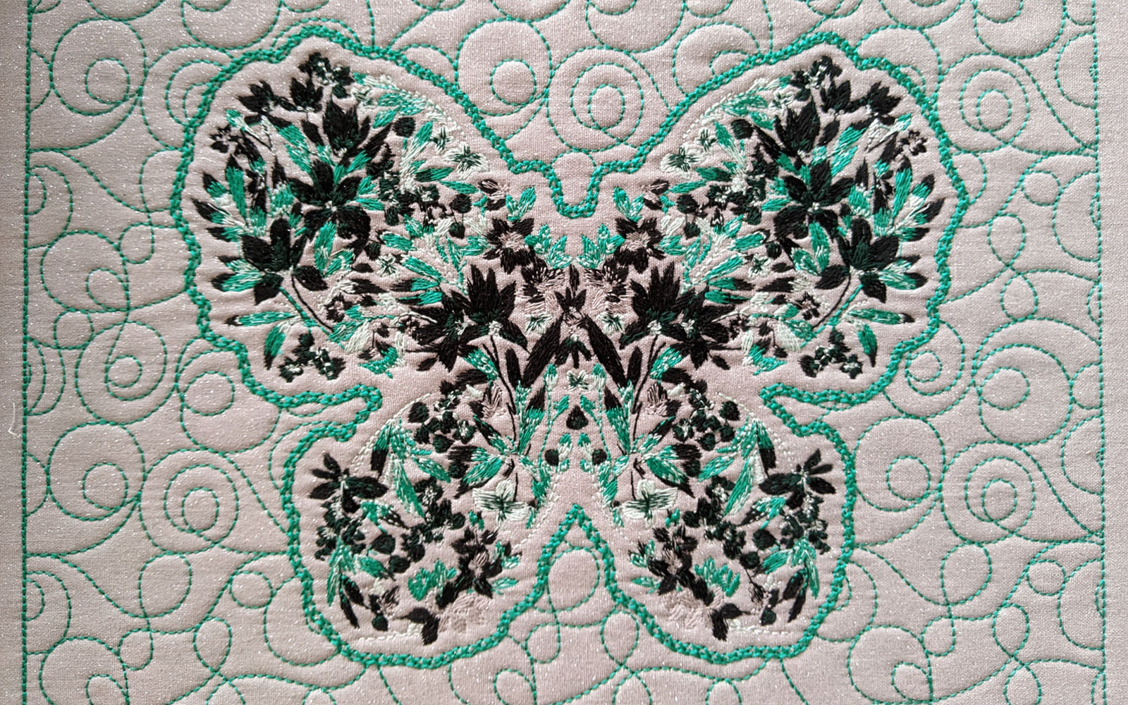 Butterfly embroidery with quilted background