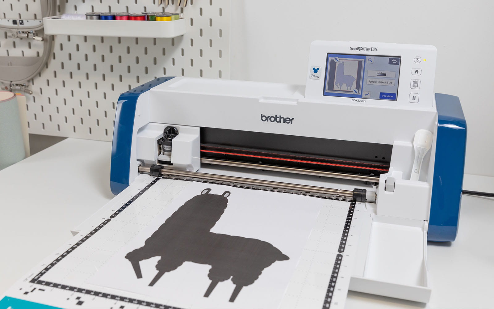 Black llama icon being scanned into Brother ScanNCut