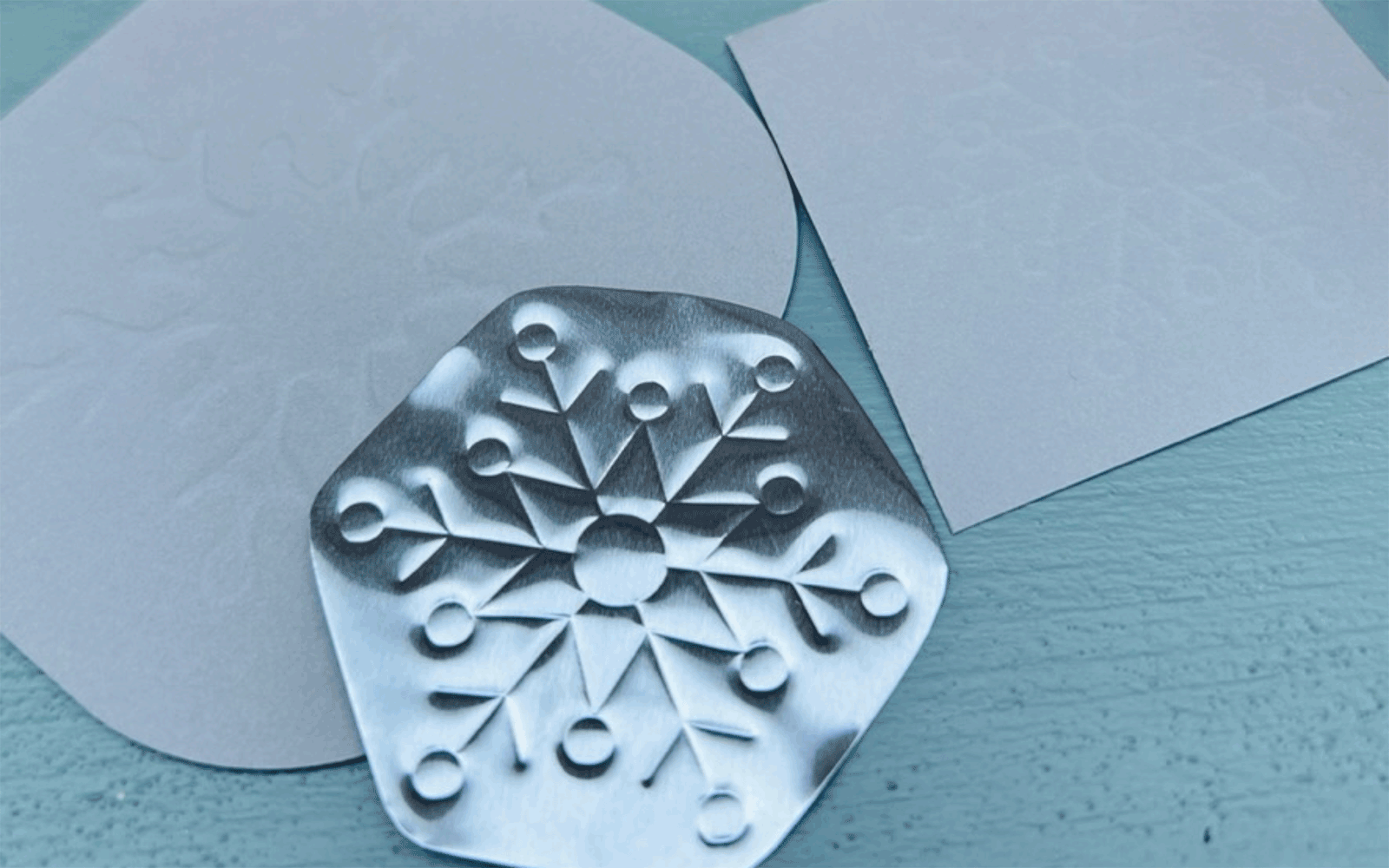 Snowflake embossed on thin metal