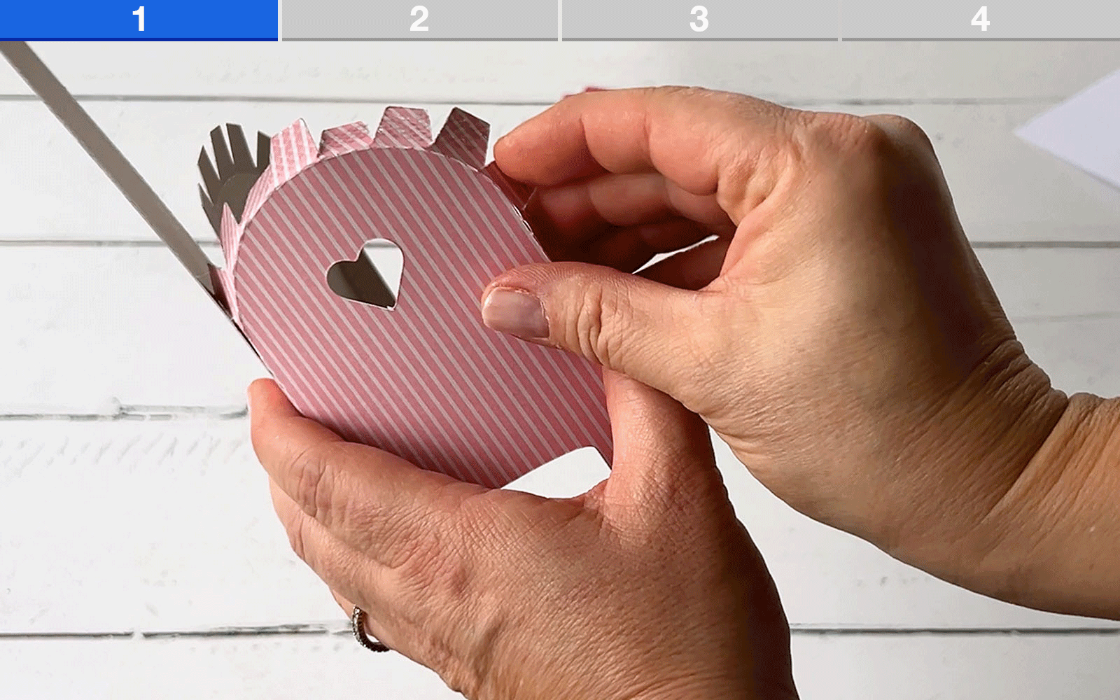 Hands folding card