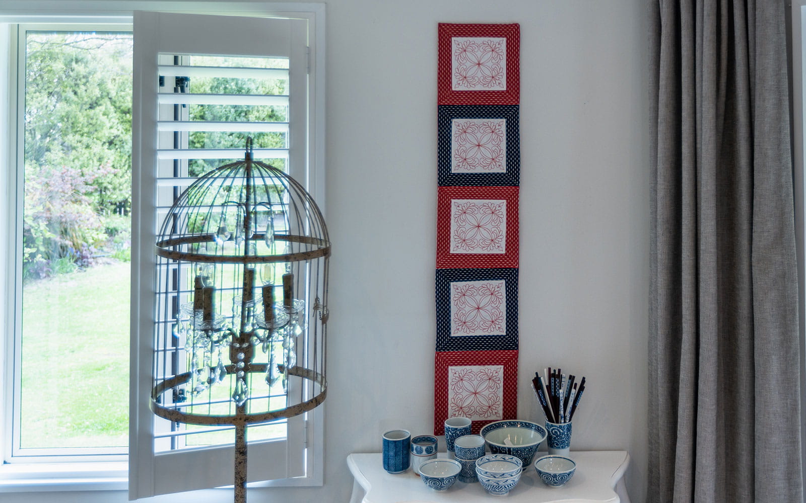 table runner made of squares hung on white wall