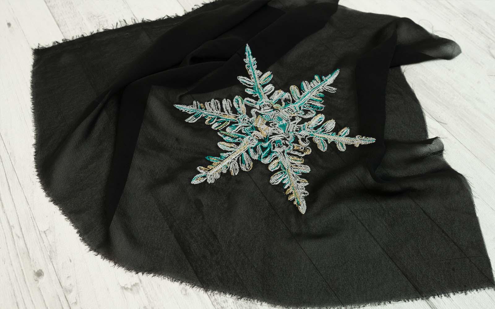 Embroidered star on black fabric