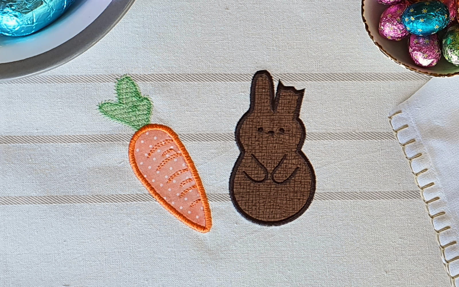 Orange carrot and brown bunny embroidered on placemat