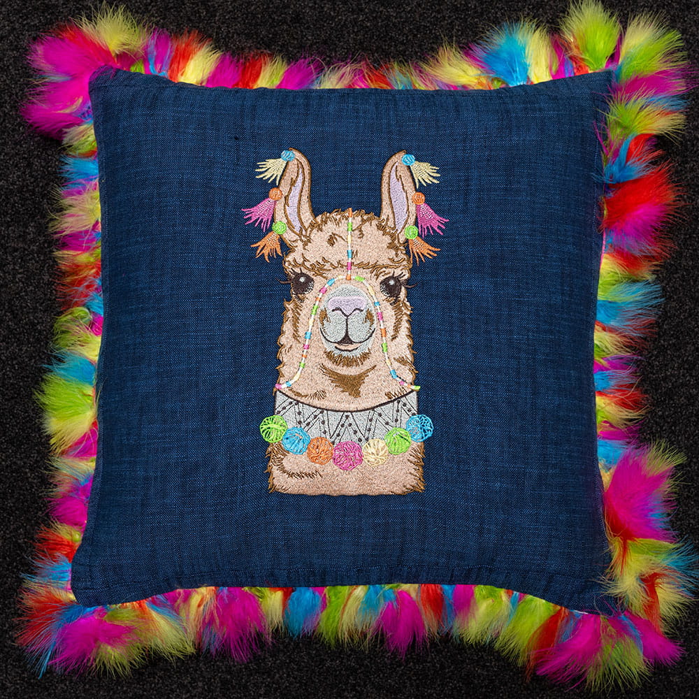 blue embroidered llama face embroideries with multi-coloured tassels