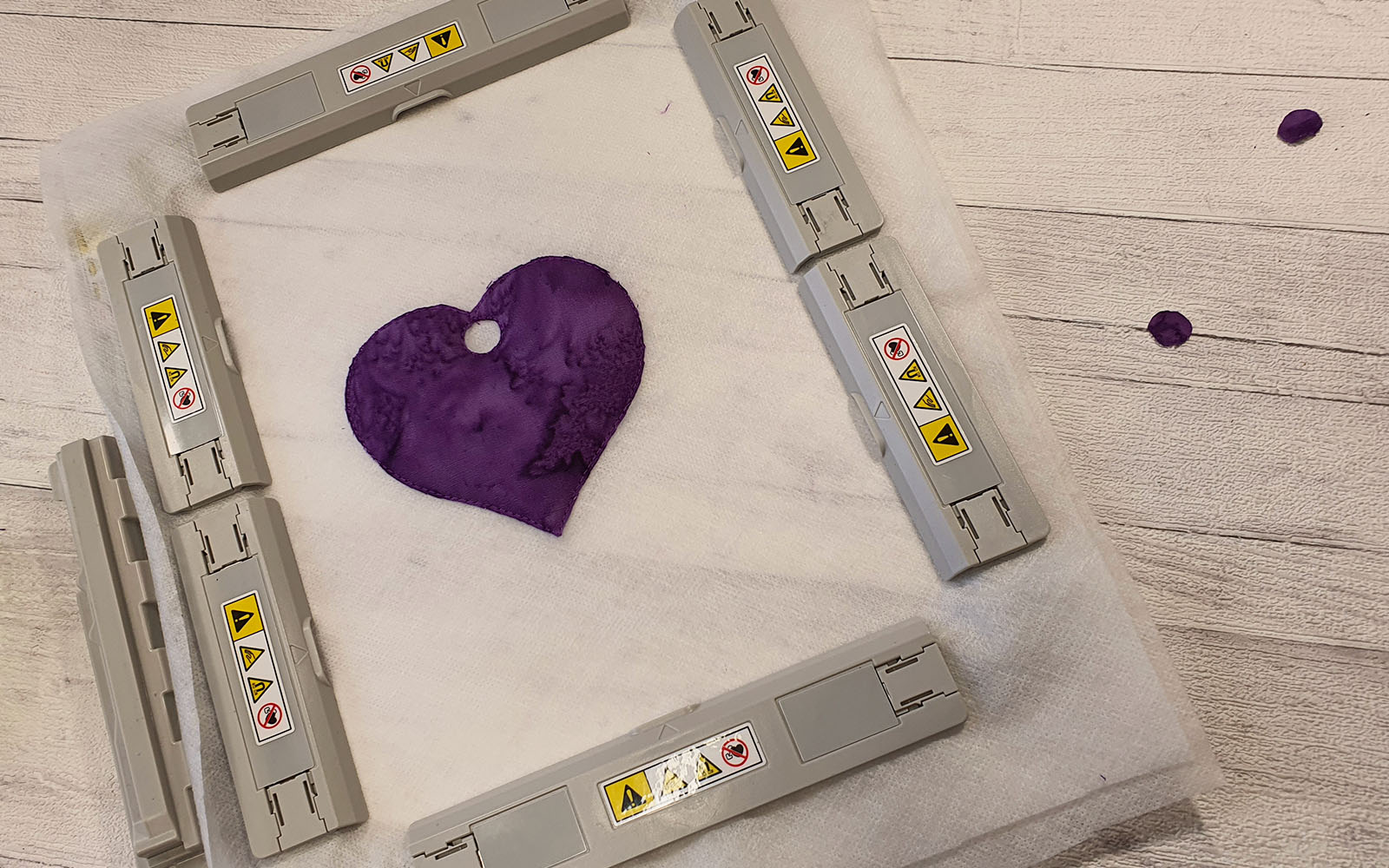 Purple Heart in embroidery hoop