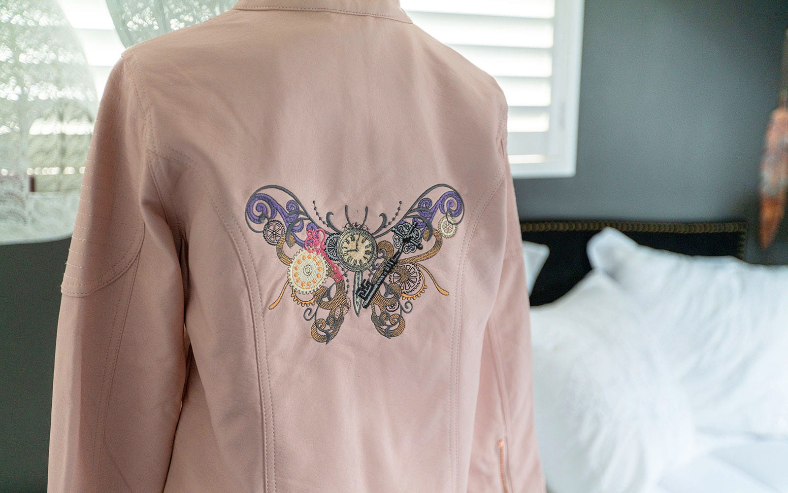 pink pleather jacket with large steampunk buttery embroidered on