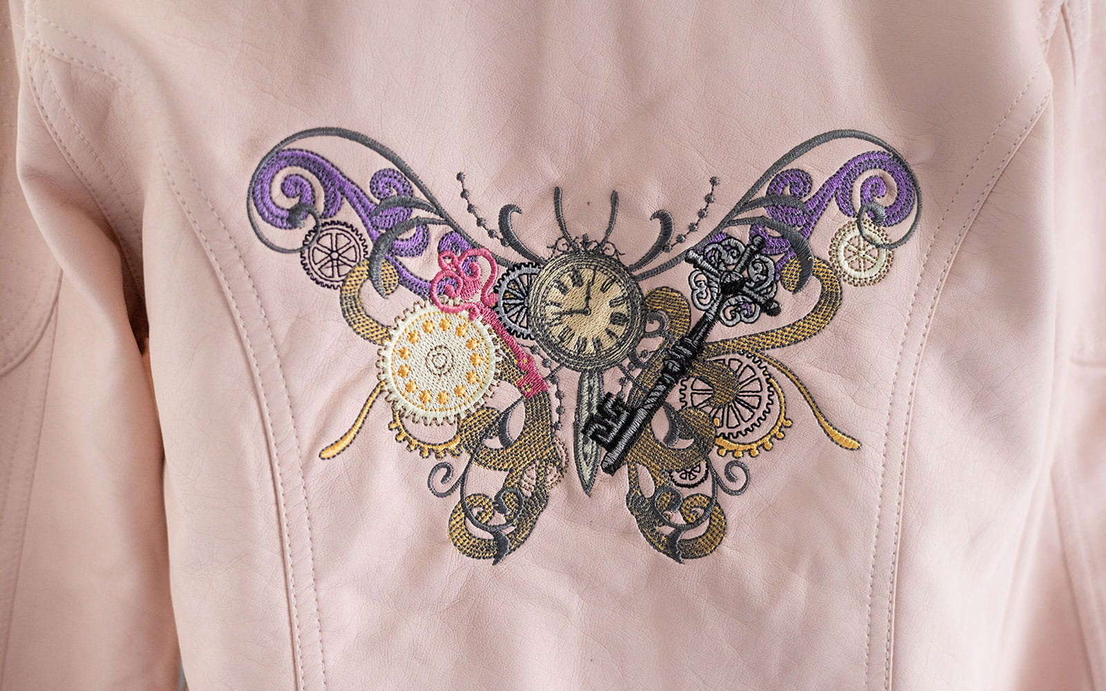 large embroidered steampunk butterfly made of cogs, gears and clocks