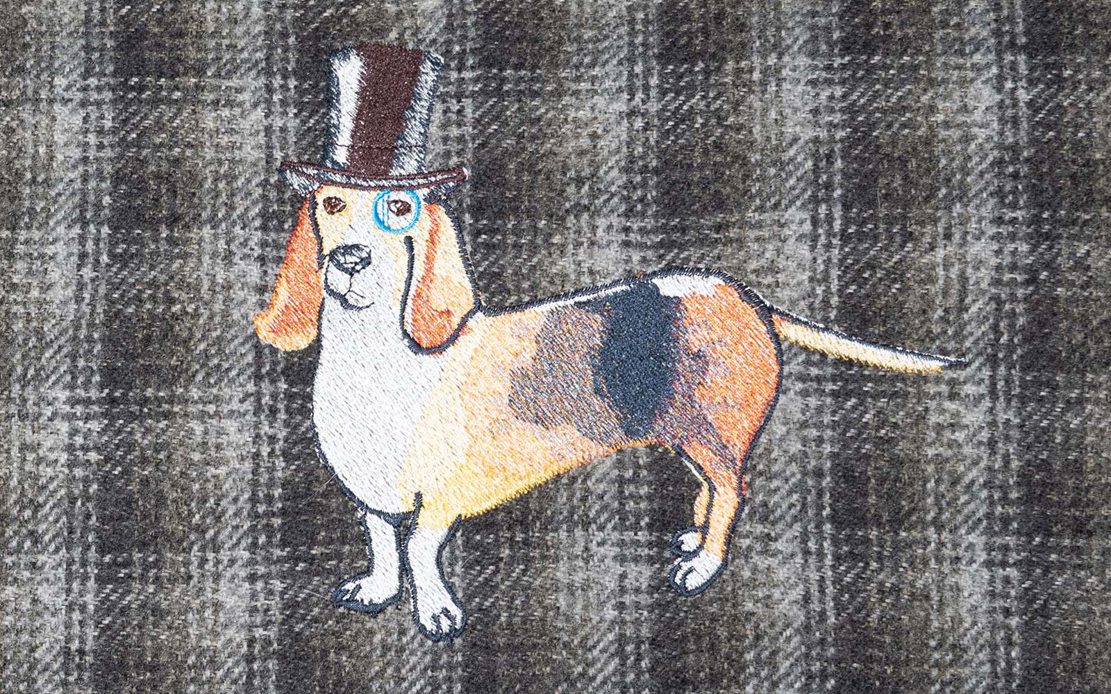 embroidered basset hound with top hat on grey check fabric