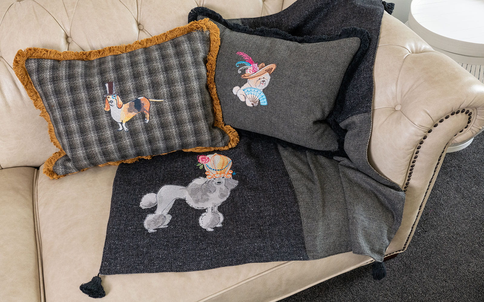 blanket and cushions with embroidered cartoon dogs