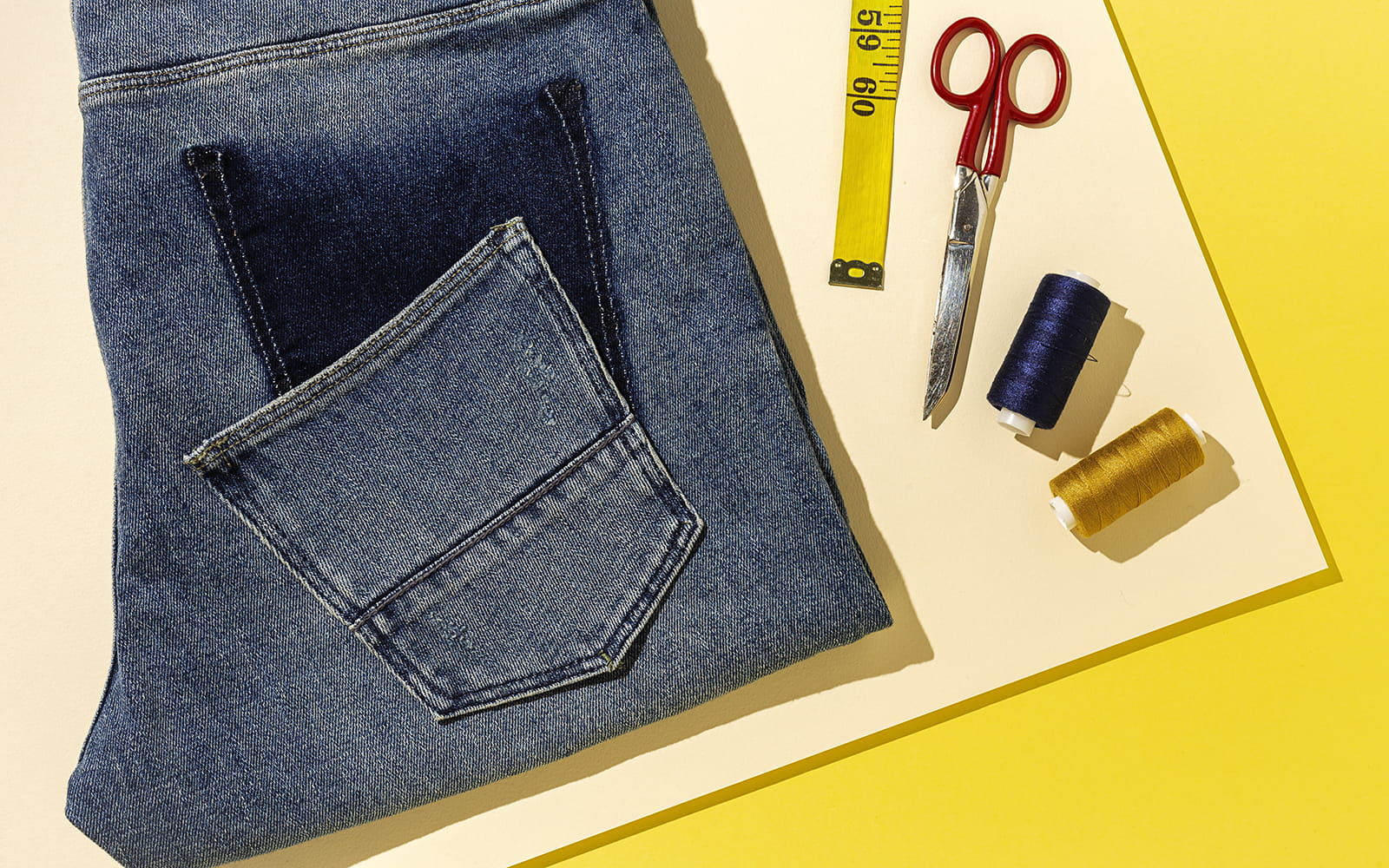 Jeans on yellow background with pocket taken off