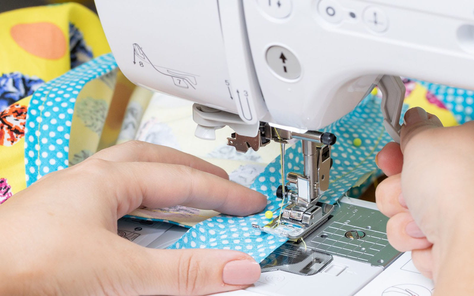 finger changing stitch length with button on sewing machine