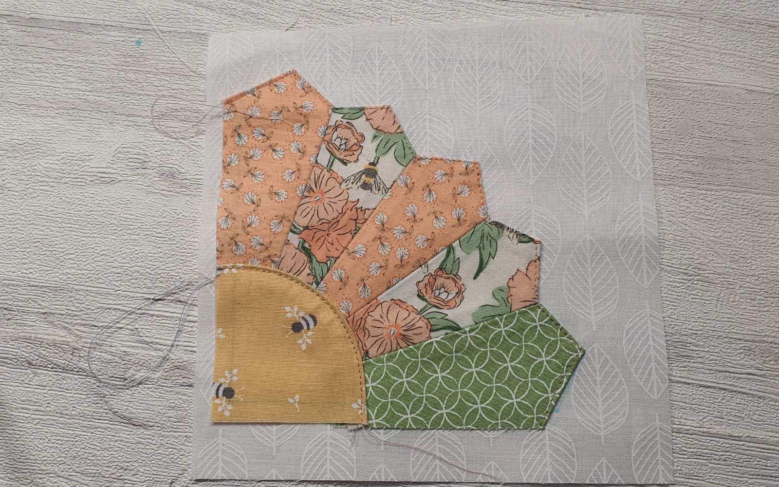 Dresden fan half sewn on fabric