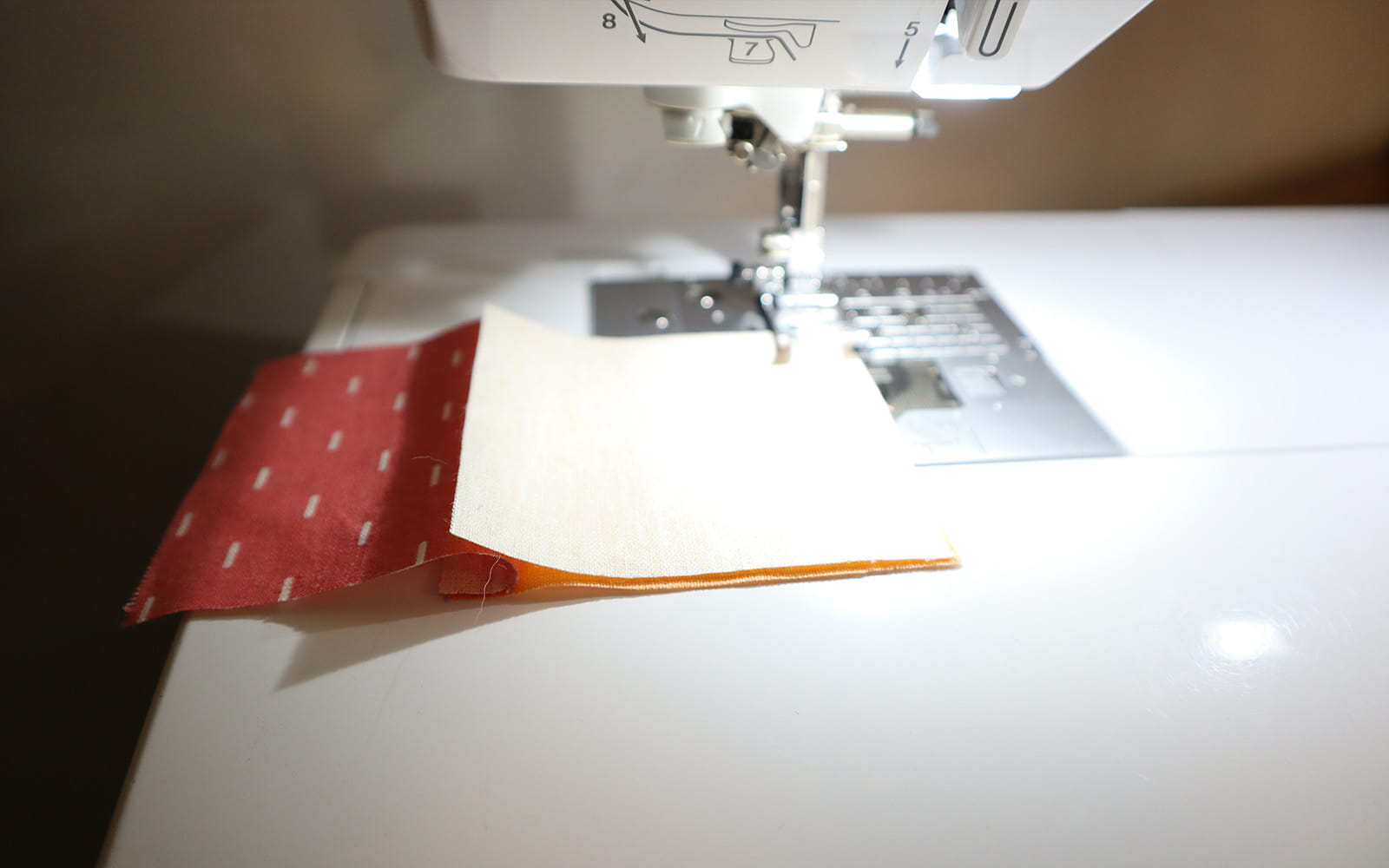 Sewing fabric squares together with straight stitch