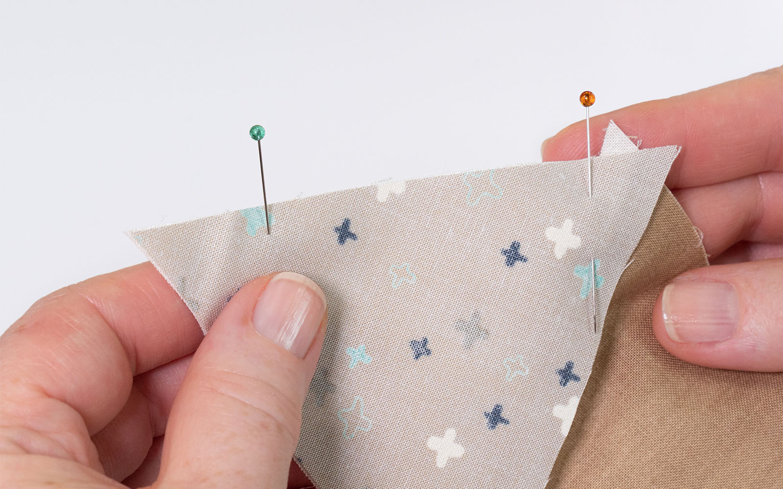 Triangles of fabric pinned