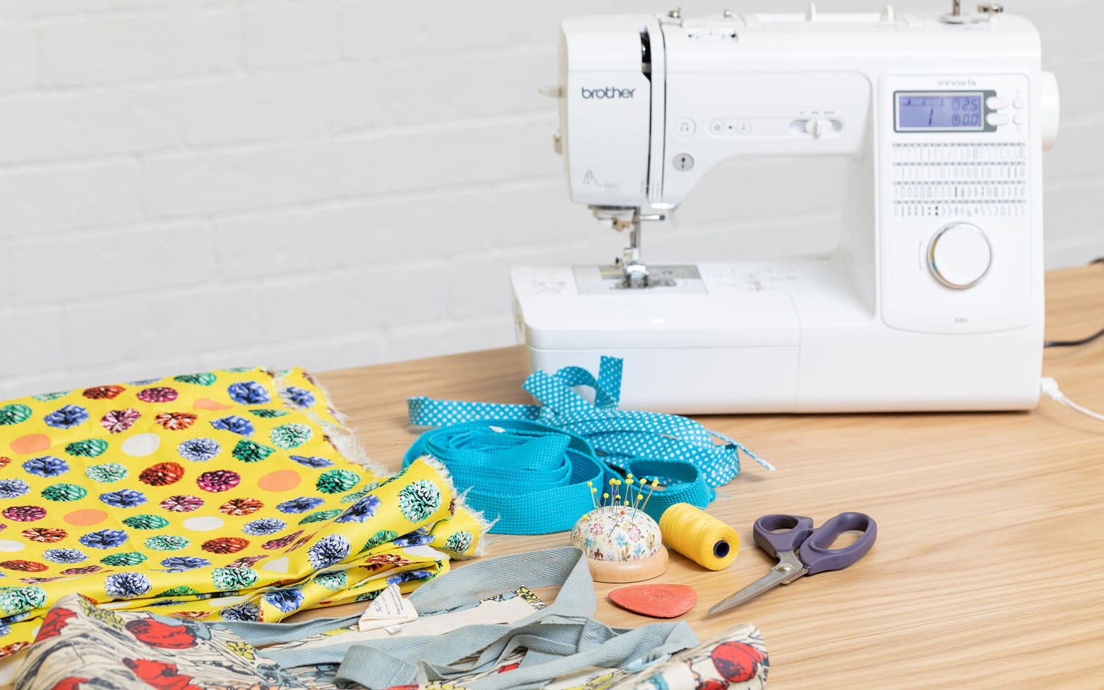 sewing materials to make apron and sewing machine on table