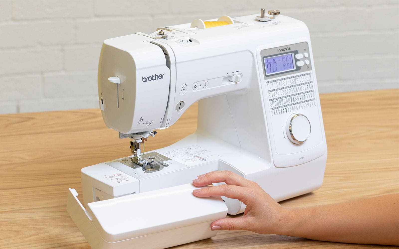 Removing accessory compartment on sewing machine