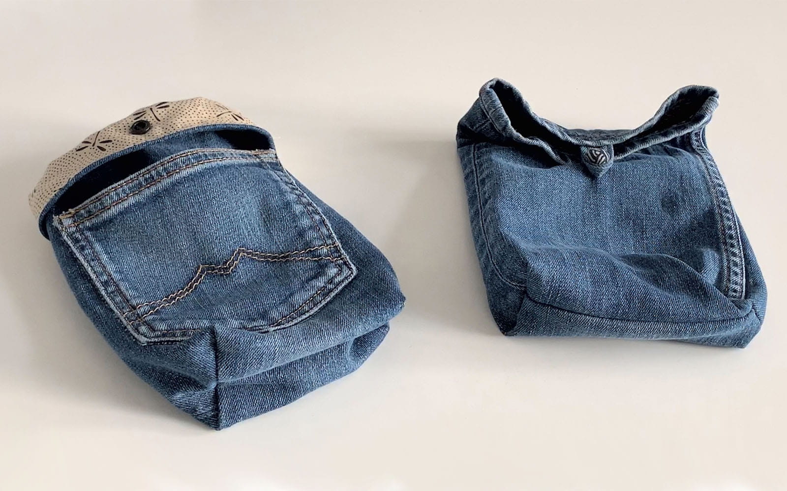 two small upcycled blue denim pocket bags on white background