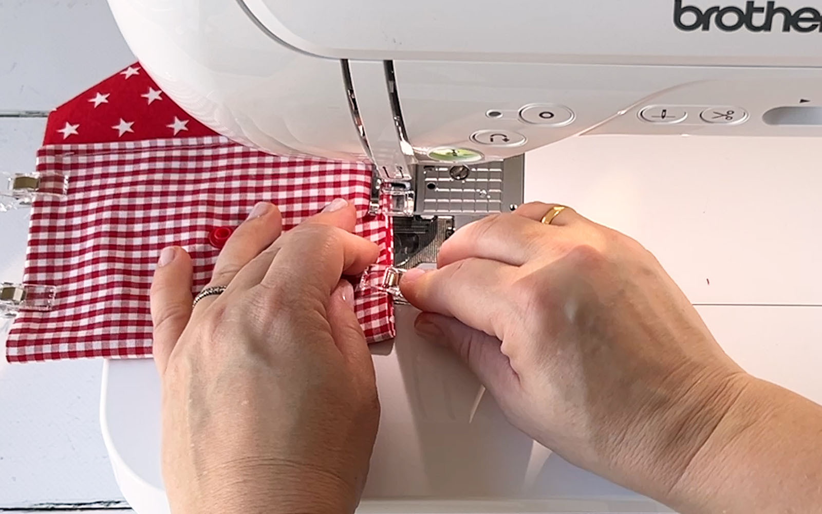 Red and white gingham fabric on Brother sewing machine