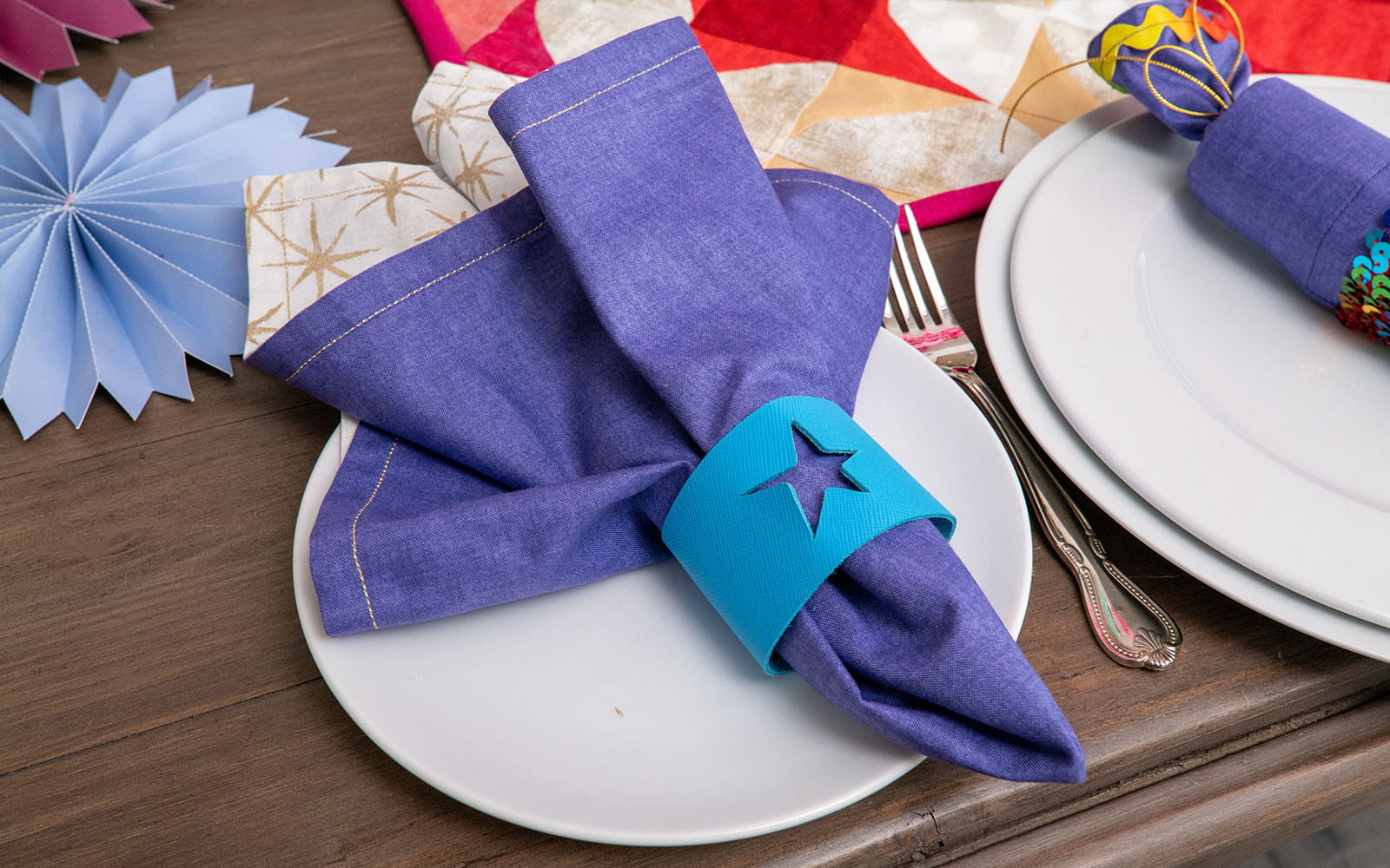 cloth napkin with napkin ring on plate
