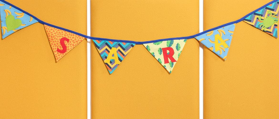 bright coloured birthday bunting that says Sara on yellow background