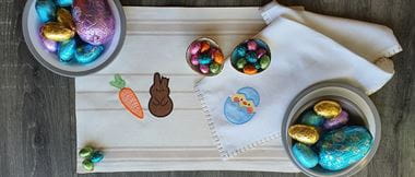 Embroidery and easter eggs on cream placemat