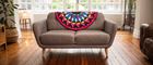 Sofa in living room with kaleidoscope quilt