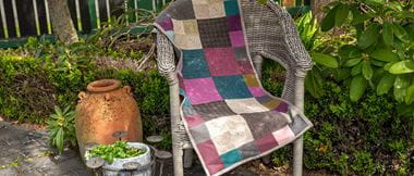 brown burgundy and teal runner quilt made of large and small square wool fabric blocks