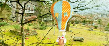 fabric bunny in polka dot sewn hot air balloon