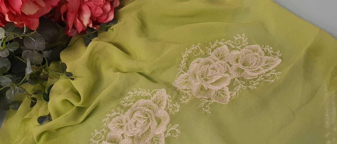 Rose embroidery on green chiffon