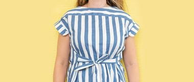 Woman wearing blue and white striped top made of man’s shirt