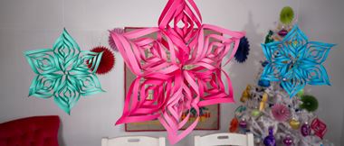 3D paper stars in green, pink and blue