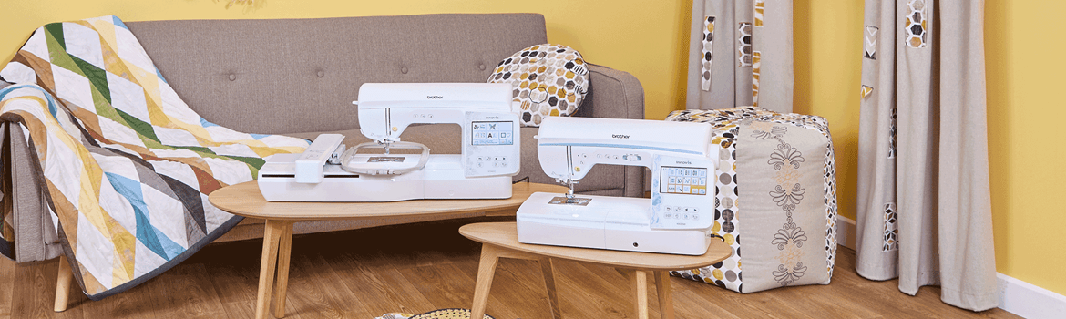NV880E and NV2700 sewing and embroidery machines on coffee tables