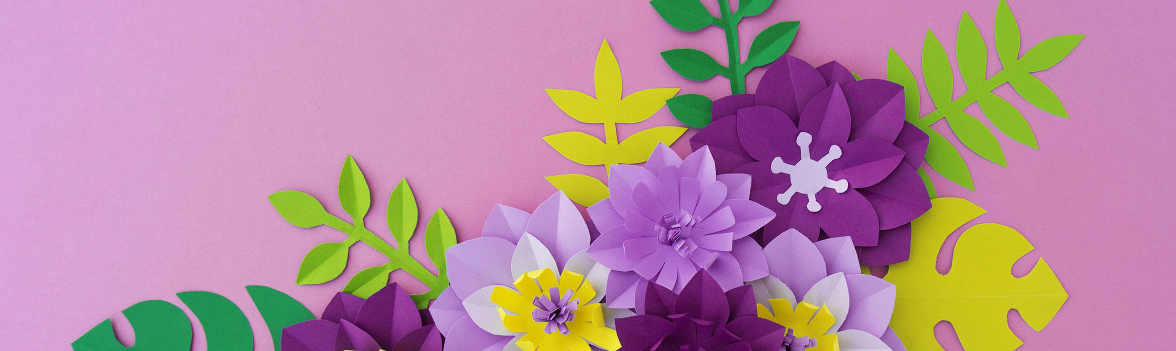 Purple paper flowers on light purple background