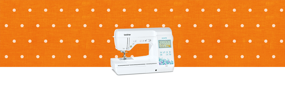 Sewing machine on lime green background with blue and orange stripes