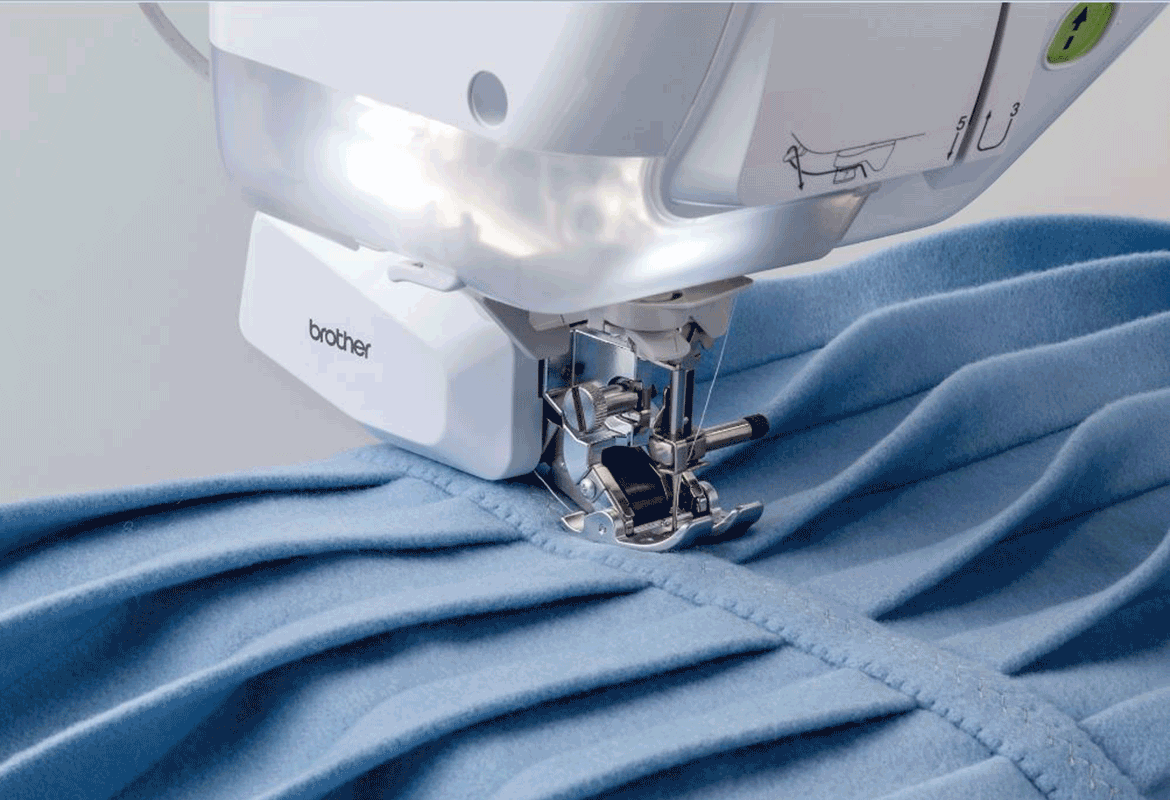 Dynamic walking foot on blue pleated fabric