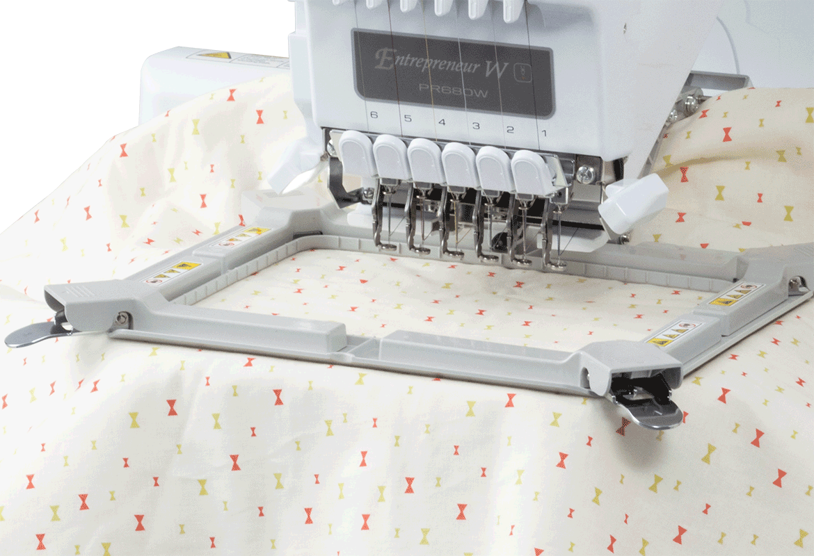 Magnet frame on PR embroidery machine with colourful fabric