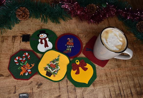 A selection of felt coasters with Christmas decorations