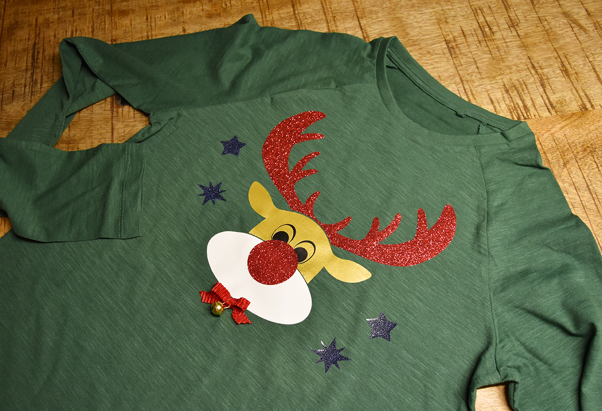 Green shirt with fun reindeer design