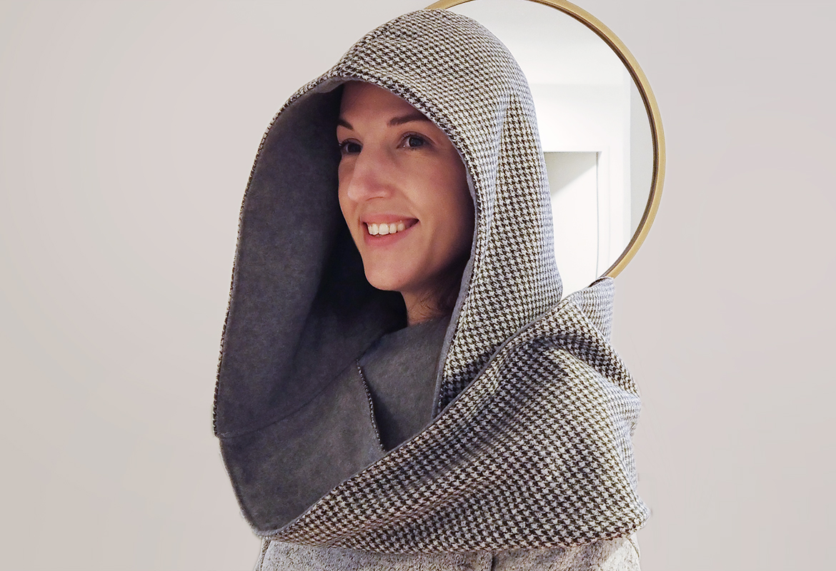 Lady wearing a grey hooded scarf